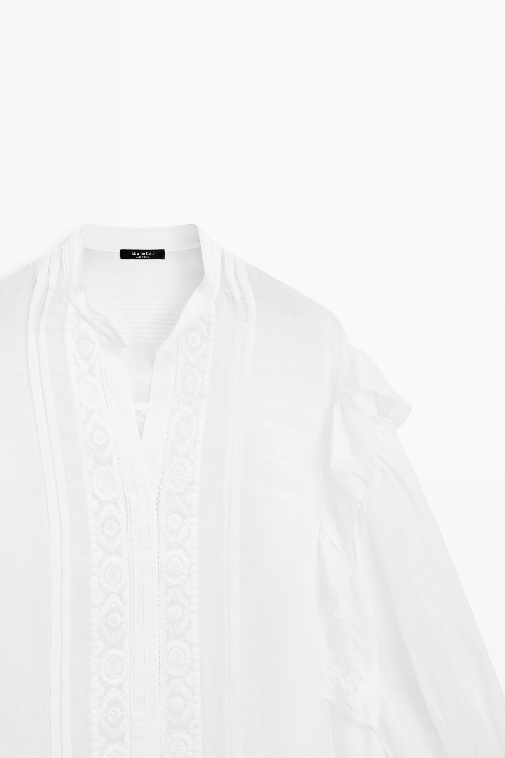 Stand collar blouse with embroidery and ruffles